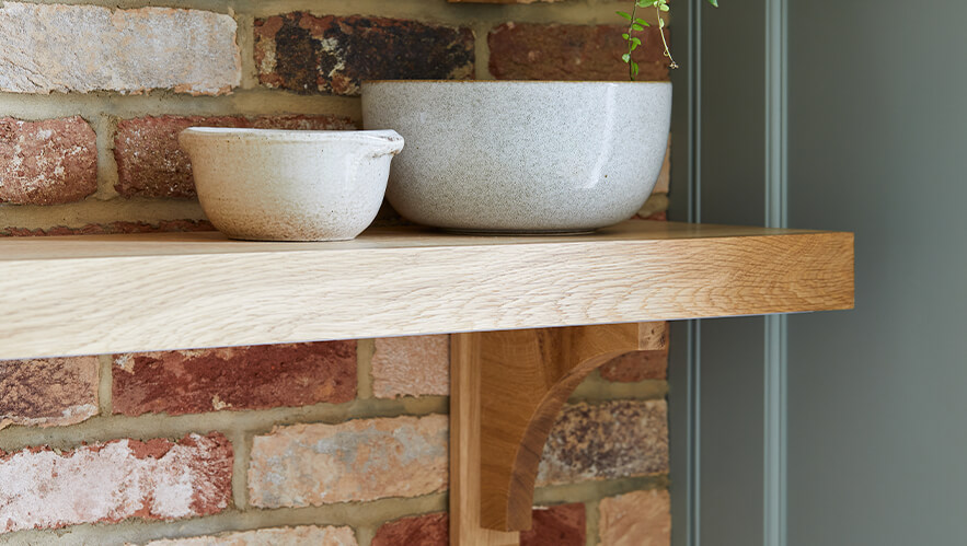 A beautifully handmade kitchen with exposed brick and solid timber in surbiton