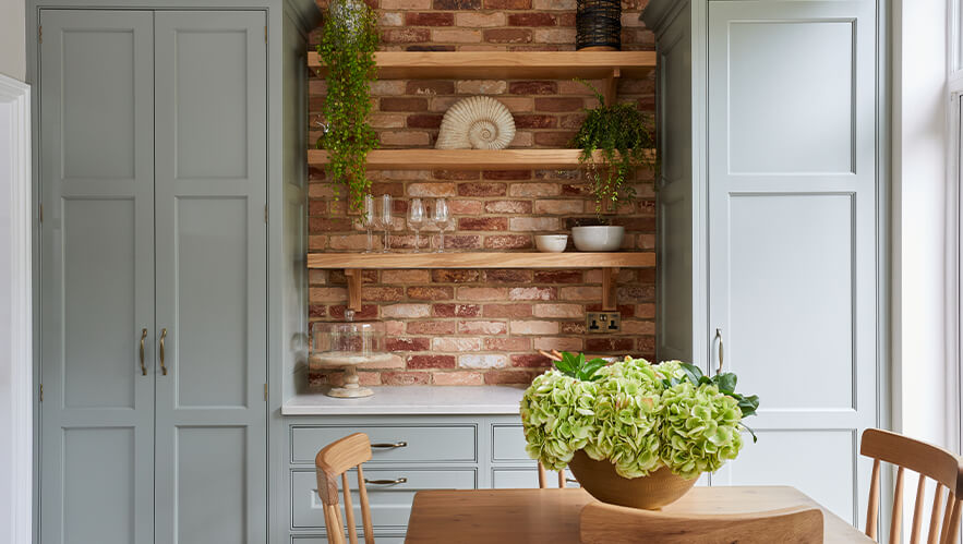 A beautifully handmade kitchen with exposed brick and solid timber in surbiton