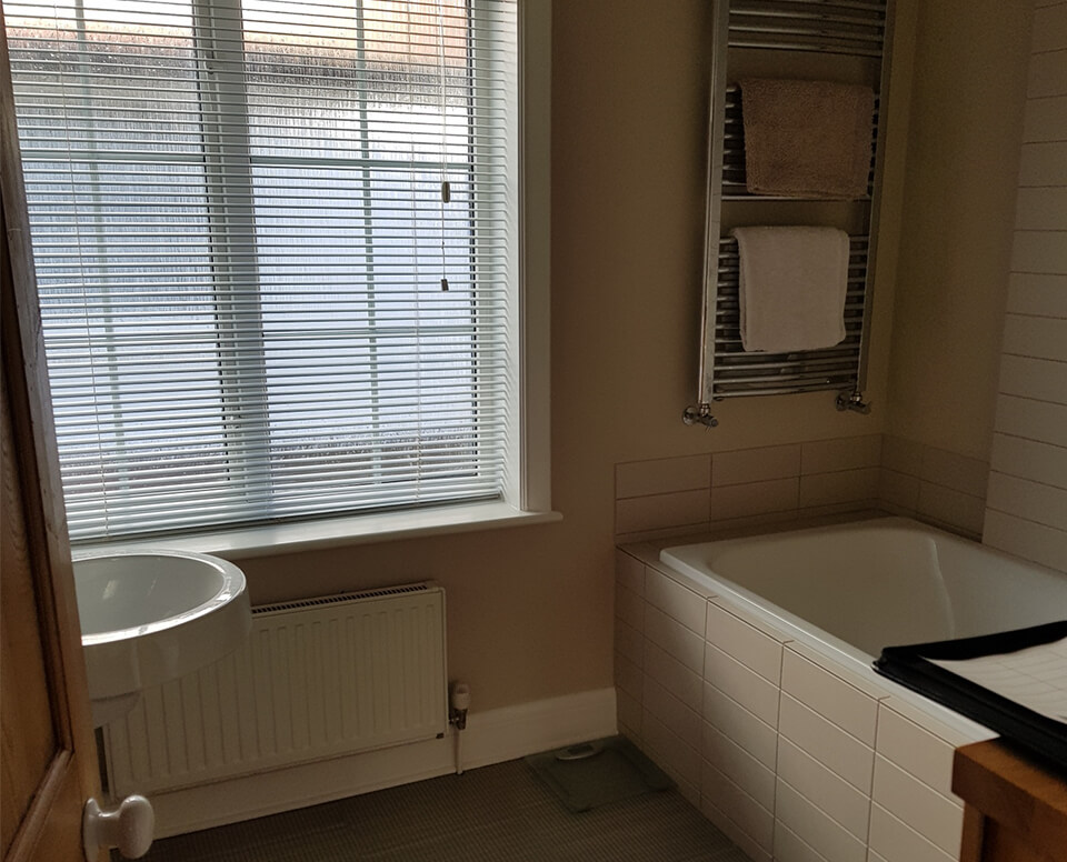 Family bathroom in Teddington Before