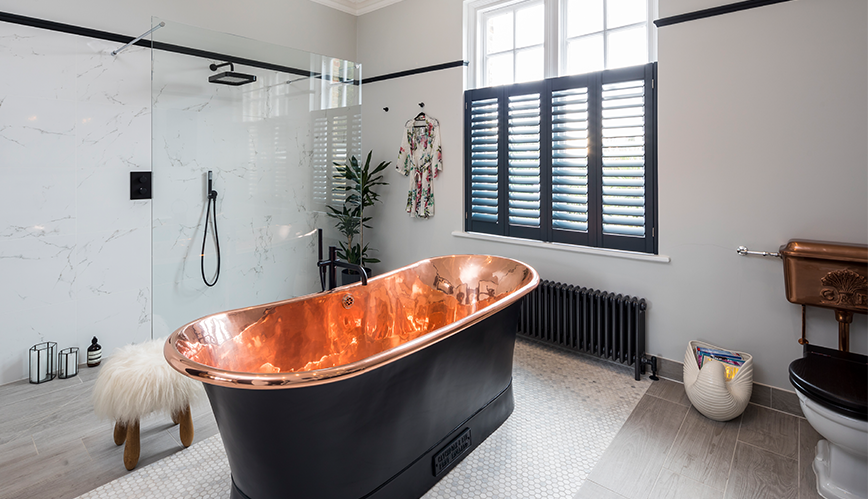glamorous black and copper master en suite in surbiton