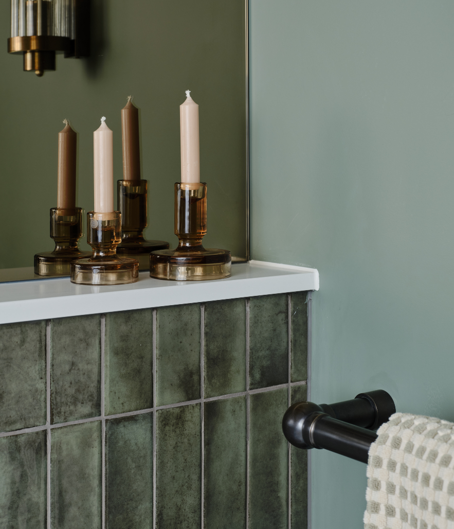 Rugged alligator iridescent tiles paired with natural materials creates warmth for this family bathroom in a Grade II listed home in Great Bookham.