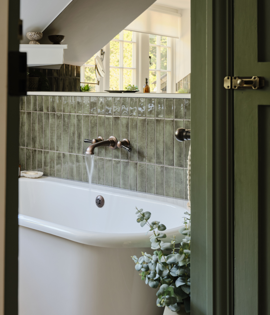 Rugged alligator iridescent tiles paired with natural materials creates warmth for this family bathroom in a Grade II listed home in Great Bookham.