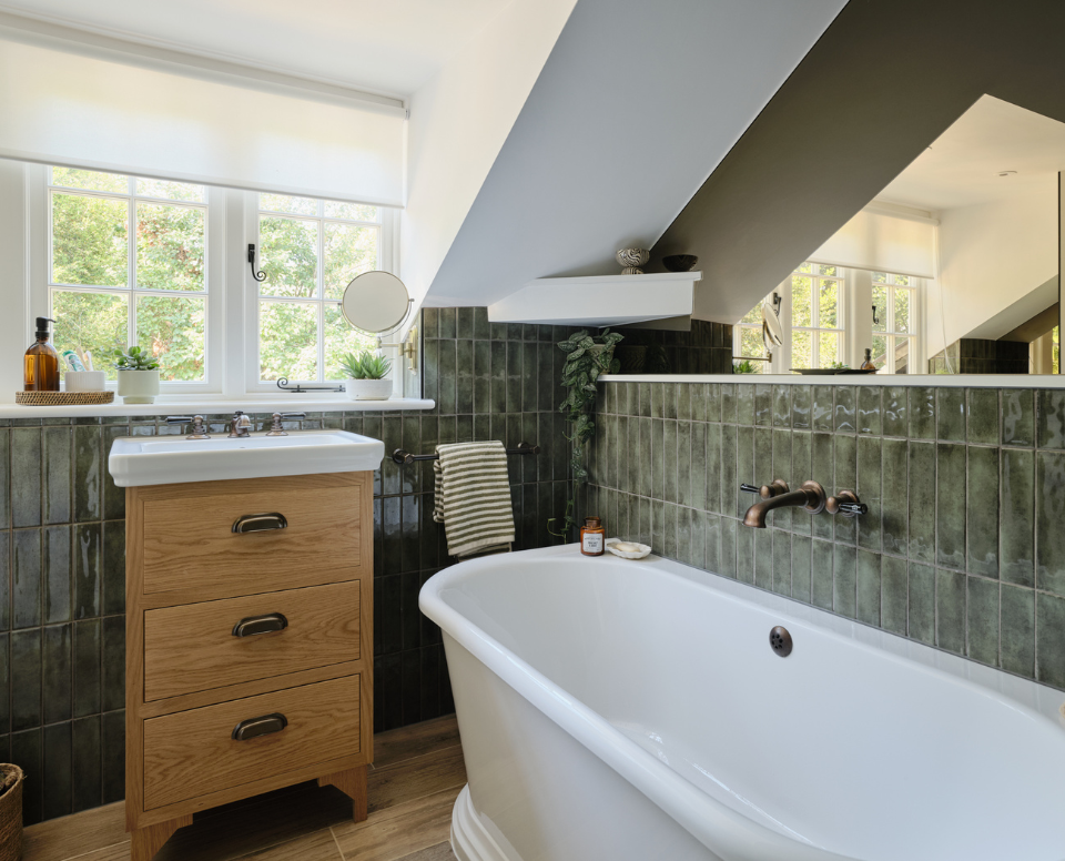 Rugged alligator iridescent tiles paired with natural materials creates warmth for this family bathroom in a Grade II listed home in Great Bookham.