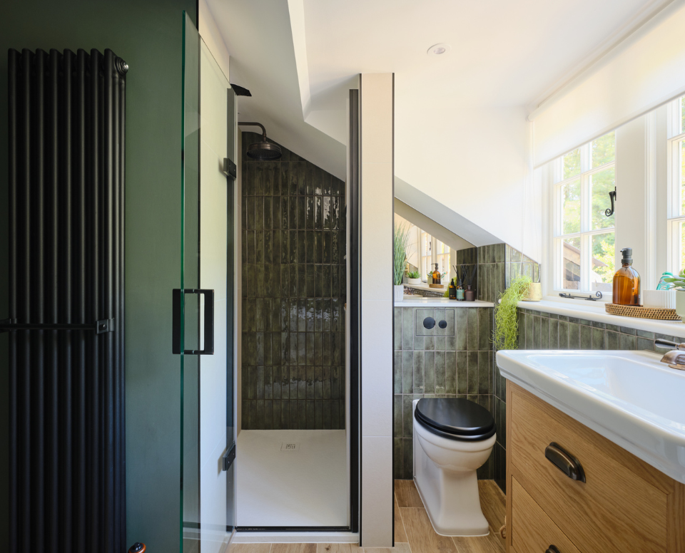 Rugged alligator iridescent tiles paired with natural materials creates warmth for this family bathroom in a Grade II listed home in Great Bookham.